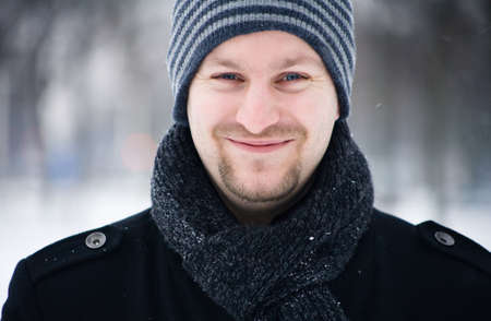 Happy couple in the snow having some fun togetherの写真素材