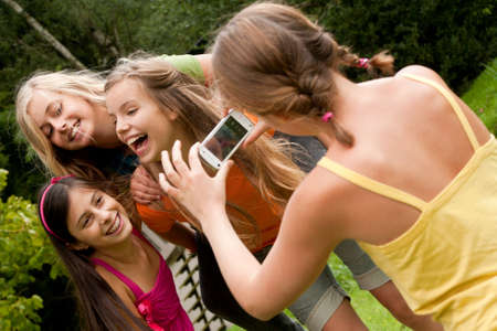 4 happy girlfriends are having a good sunny dayの写真素材