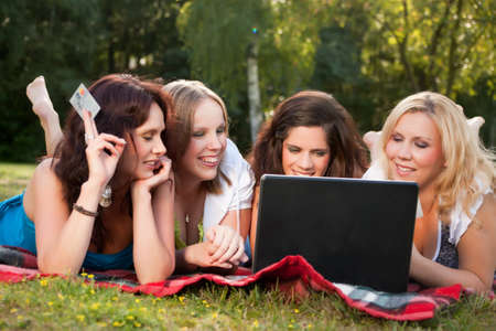 Girlfriends are having fun in the parkの写真素材