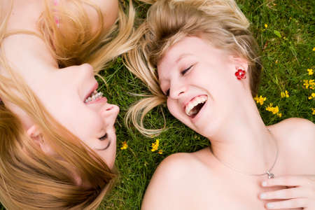 Two girls are having fun in the summer sunの写真素材