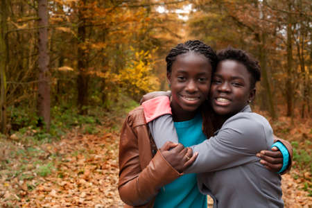 Happy foster children in the forest are having funの写真素材