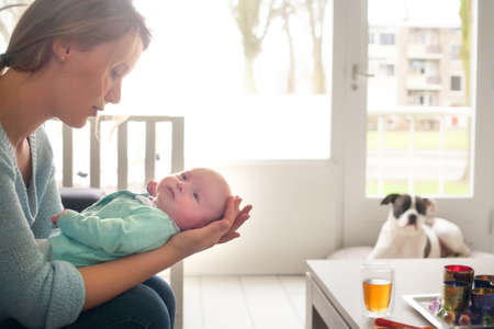 Happy young parents and their little baby