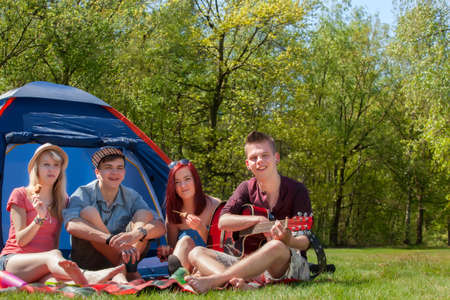 Young teenager group are having their holliday on a campingの写真素材