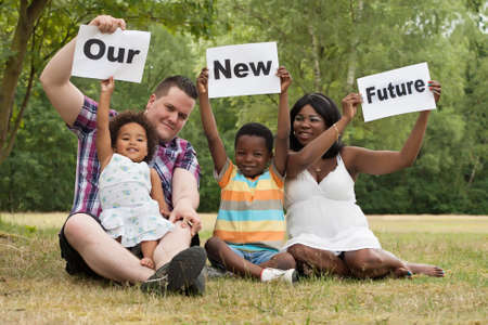 African multicultural family is holding white boardsの写真素材