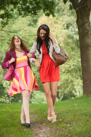 Two girls are having a lot of fun in the forestの写真素材