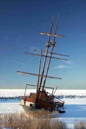 A frozen, and rusted shipwreck in Canada