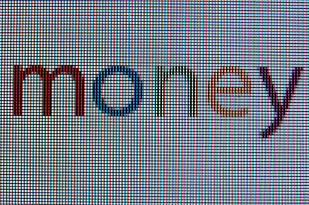 A macro image of the word "money" on a LCD screenの写真素材