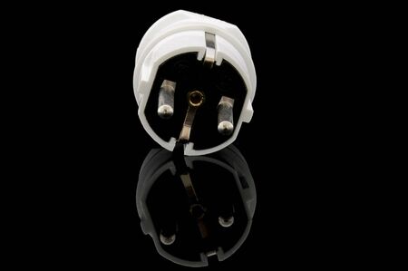An isolated image of a European power plug on a black background