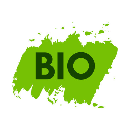 Green natural bio label. The inscription Bio on green label on hand drawn stains. vector illustrationのイラスト素材