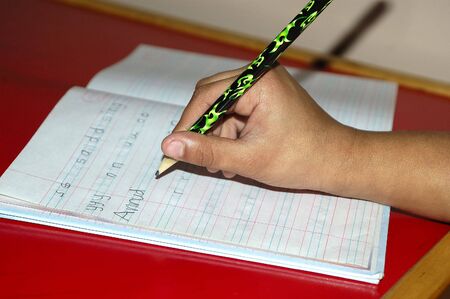 A Kid trying to write his nameの写真素材