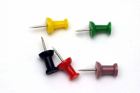 Colorful push pins against a soft background
