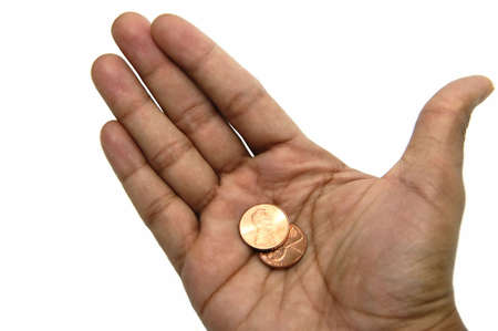 Hand holding two cents isolated against a white background