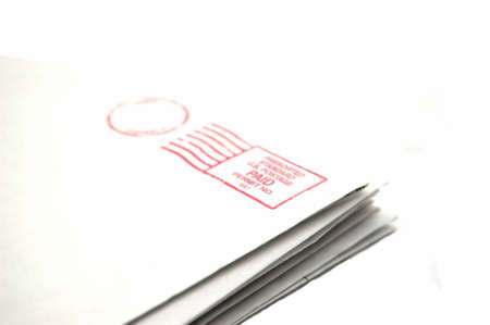 Pile of letters isolated against a white backgroundの写真素材