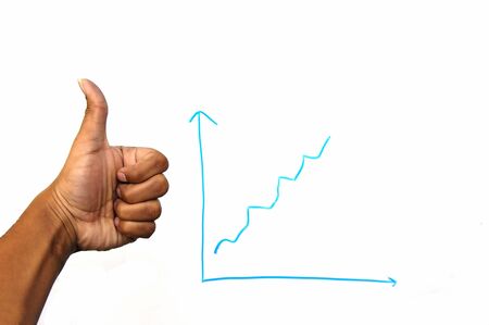 Thumbs up and a graph indicating some growthの写真素材
