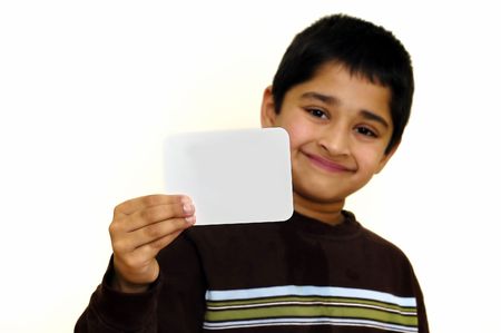 A handsome kid holding a sign ready to put your textの写真素材