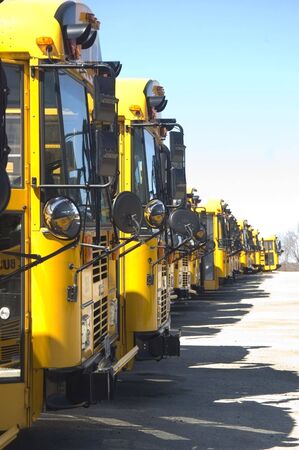 An array of school bus at a local parking lot