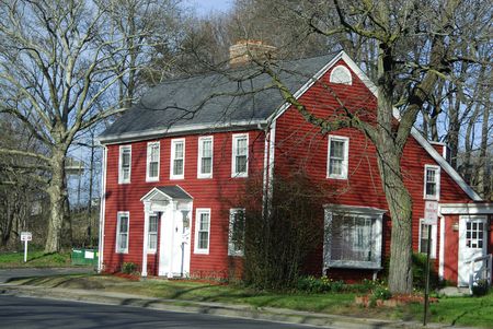 A red house during a later summer afternoonの写真素材