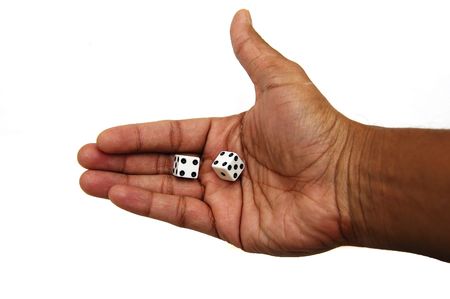A pair of dice in a hand ready to be rolled