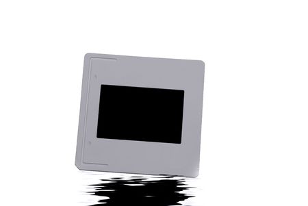 A single slide film isolated on whiteの写真素材