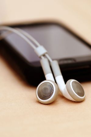 A beautiful touchscreen Mp3 player isolated on an peach back groundの写真素材