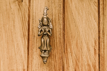 A door know with a welcome symbol in Pndicherry Indiaの写真素材