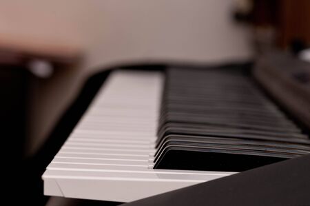 close up shot of black and white keys of a pianoの写真素材