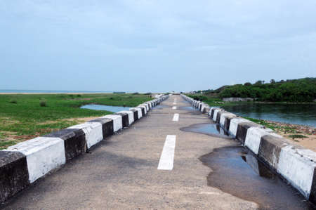 A road leading to water and country sideの写真素材