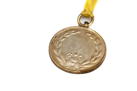 A gold medal isolated on white with space foe textの写真素材