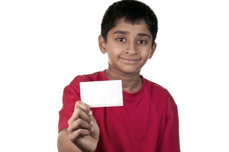 Am handsome Indian kid holding a card with a space for text