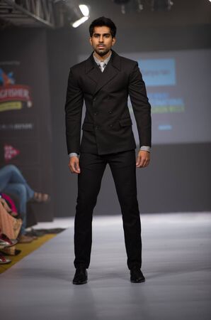 CHENNAI - JULY 21: A model walks on the ramp during the Chennai International Fashion Week runway on Jul 21, 2012 in Chennai , India.のeditorial素材