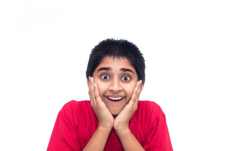 A handsome indian kid looking very excitedの写真素材