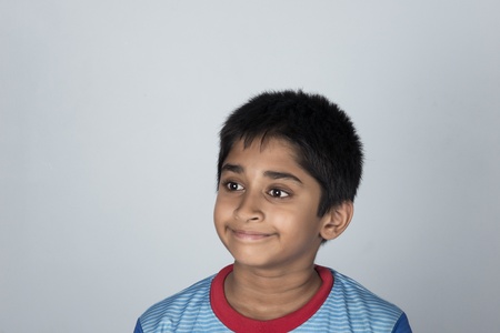 Handsome Indian boy standing outdoor smilingの写真素材