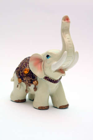 Porcelain figurine of an elephant decorated with stones and jewelryの写真素材