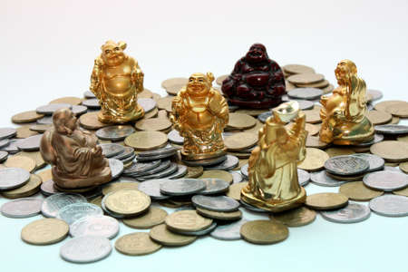 Buddha netsuke and moneyの写真素材