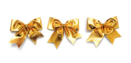 Beautiful gold bow on white backgroundの写真素材