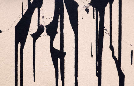 Paint dripping isolated on white backgroundの写真素材