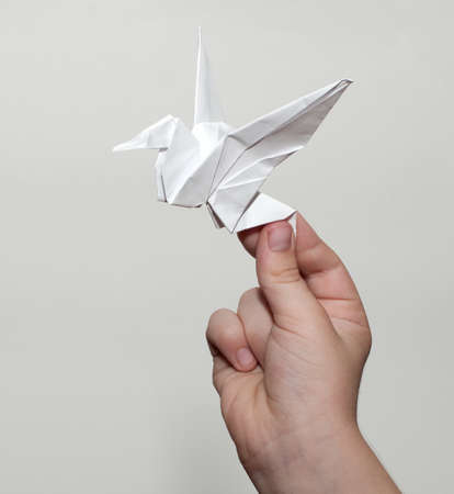 Origami crane in handの写真素材