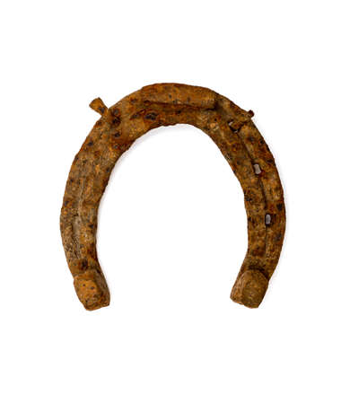 old rusty horseshoe isolated on white backgroundの写真素材