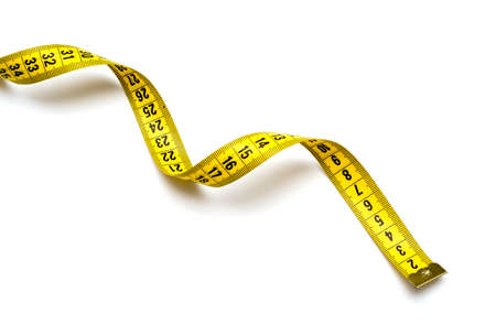 Yellow measuring tape isolated on white background