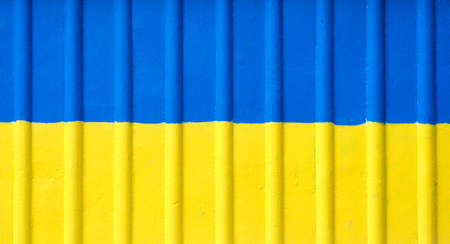 Ukraine flag graffiti painted on old concrete coated wall