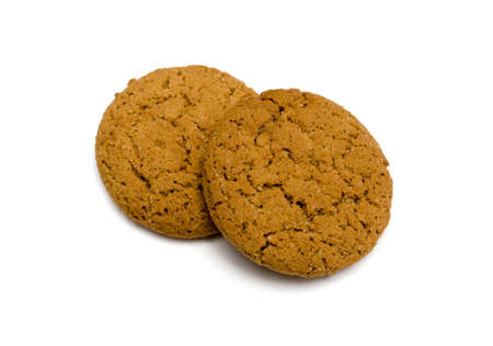 Two oat cookies closeup on white backgroundの写真素材