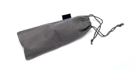 Grey drawstring bag packaging isolated over white backgroundの写真素材