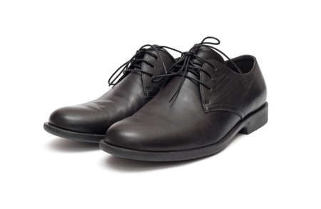 black men's shoes on a white backgroundの写真素材