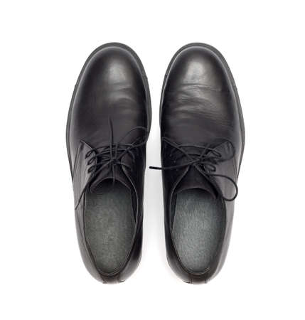 black men's shoes on a white backgroundの写真素材