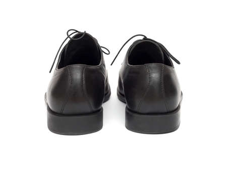 black men's shoes on a white backgroundの写真素材