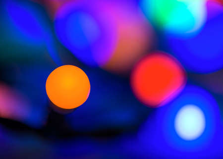 Abstract vibrant bright round bokeh over dark backgroundの写真素材