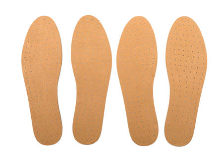 Brown insoles for shoes on a white backgroundの写真素材