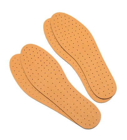 Brown insoles for shoes on a white backgroundの写真素材