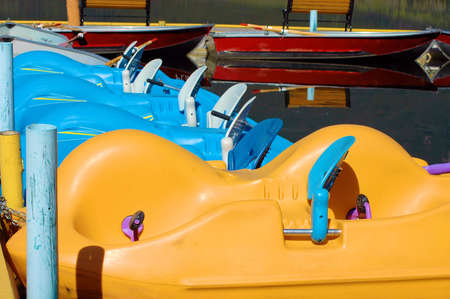 Paddle boats on a dock.の写真素材