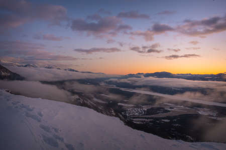 Cloudy columbia valley mountain sunset in winter, near Invermere British Columbia, Canadaの写真素材